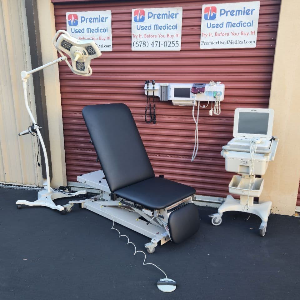 For Sale CLINTON 80360 Power w New Black Upholstery and Stirrups Exam Table