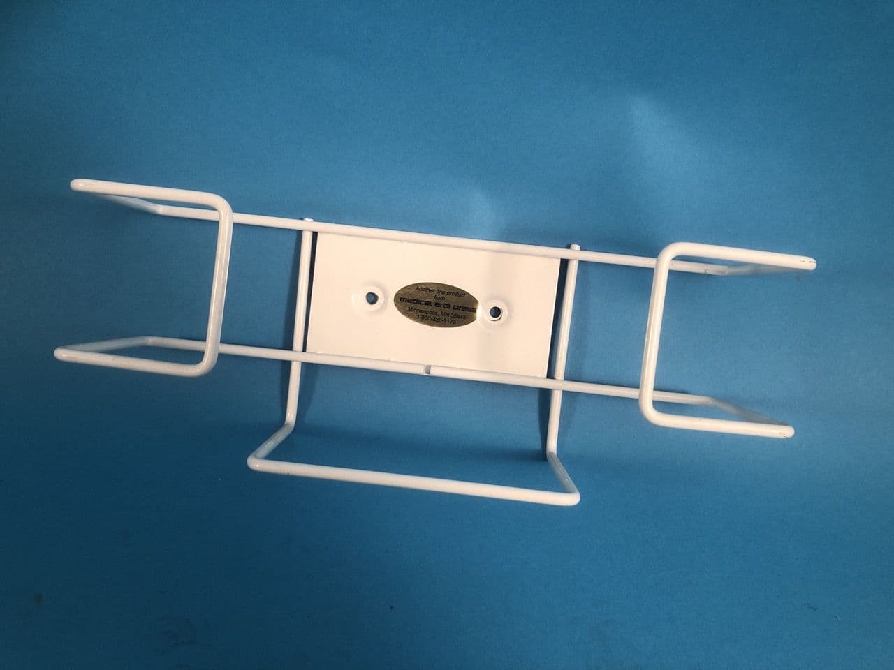 For Sale MEDICAL ARTS PRESS Glove Box Rack: Industrial duty. PVC coated. Holds one box of gloves horizontally or two boxes vertically. Mount to wall or pla